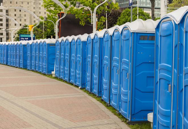 a row of portable restrooms at an outdoor special event, ready for use in Goodyear AZ